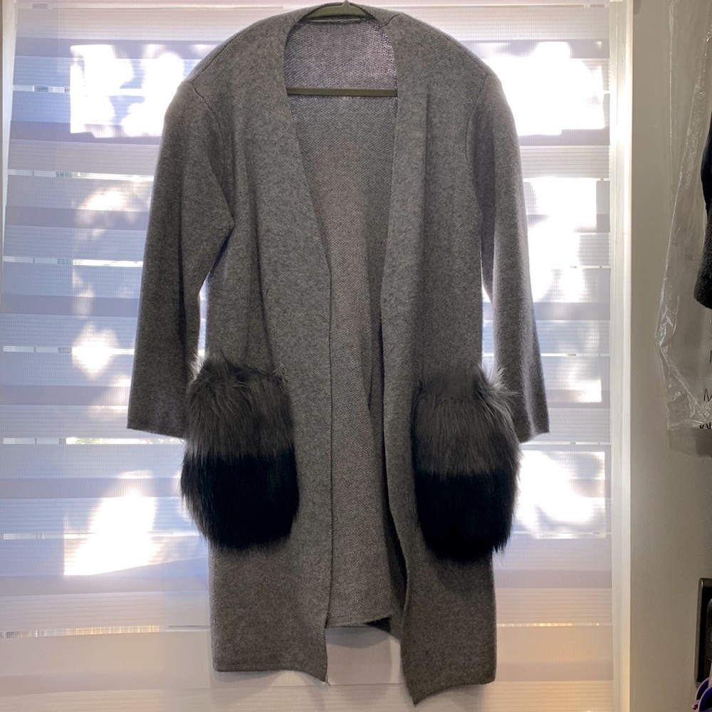 Gray sweater with fur pocket detail
